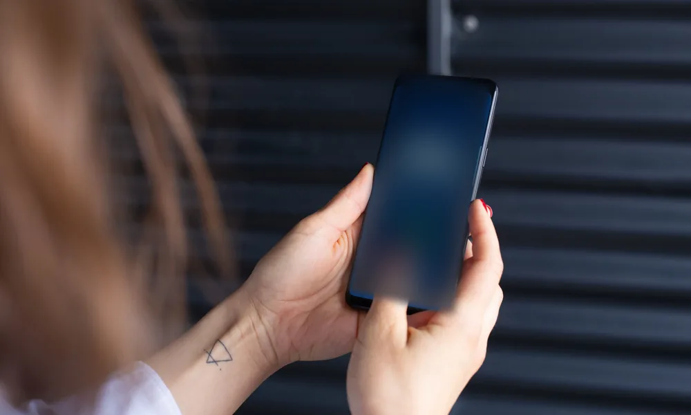 Smartphone used to review mobile access and app safety guidance