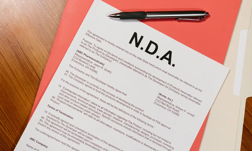 Documents and pen illustrating the bet22 India legal caution page