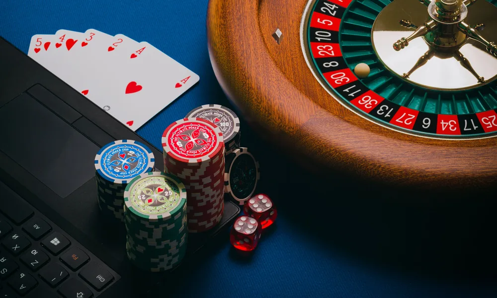Real casino table with roulette cards and chips for the bet22 live casino guide