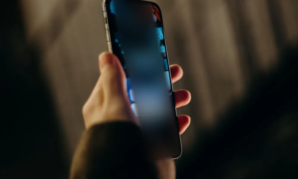 Person checking a mobile account access screen before bet22 registration